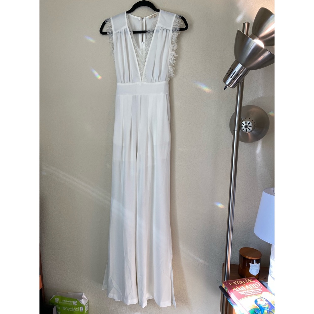 White sleeveless lace neckline  jumpsuit